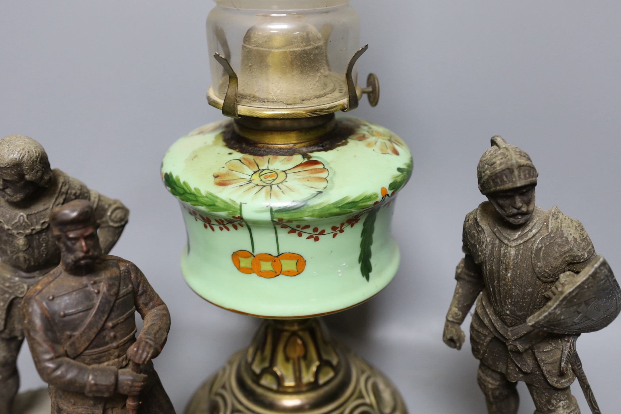 Two pairs of spelter figures, an relief cast portrait plaque, and oil lamp